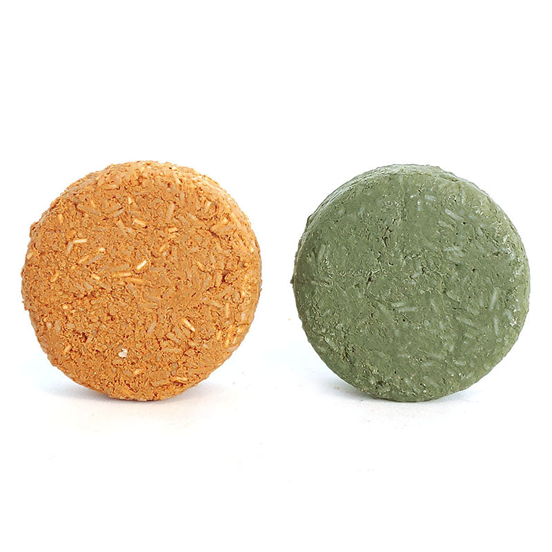 image of two shampoo bars, naked, one is orange and one is green