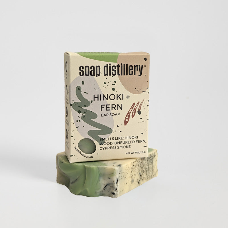hinoki + fern bar soap in colorful paperboard packaging against a light grey background