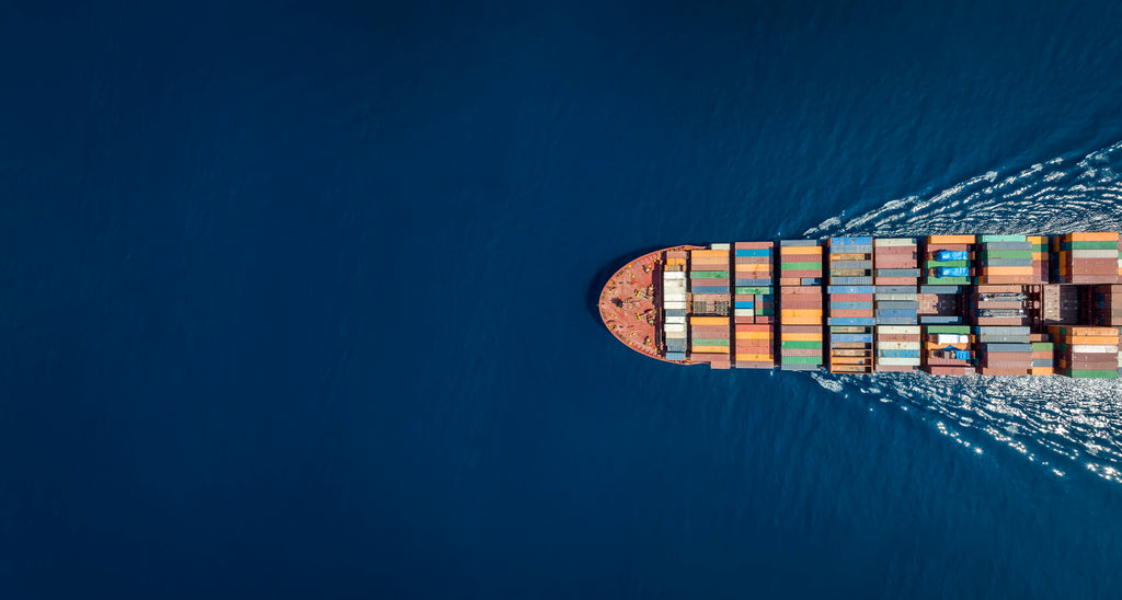 aerial view of a cargo ship full of shipping containers