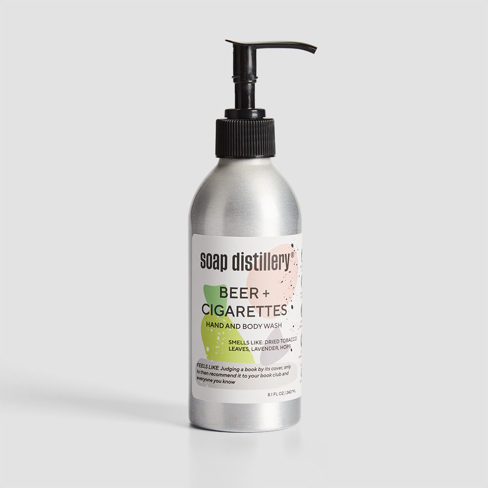 front shot of body wash in silver aluminum bottle with a white label with grey and green colors