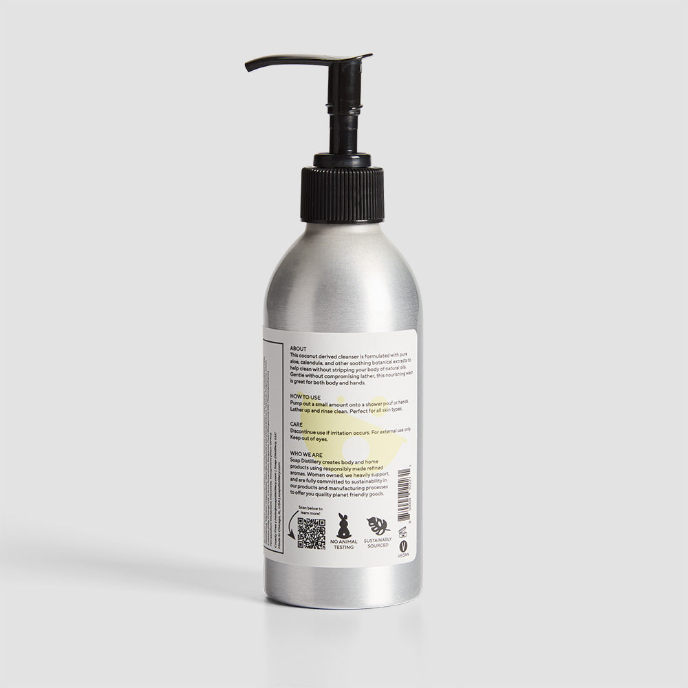 back shot of body wash in silver aluminum bottle with a white label with yellow colors