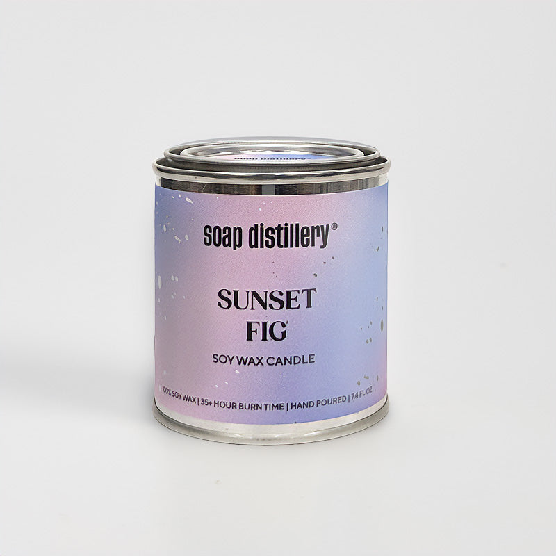 candle in a small paint can with a purple and lavender colored label