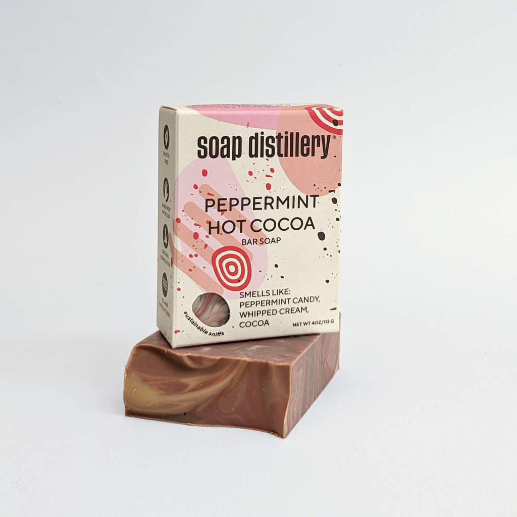 peppermint hot cocoa bar soap in colorful packaging against a light grey background