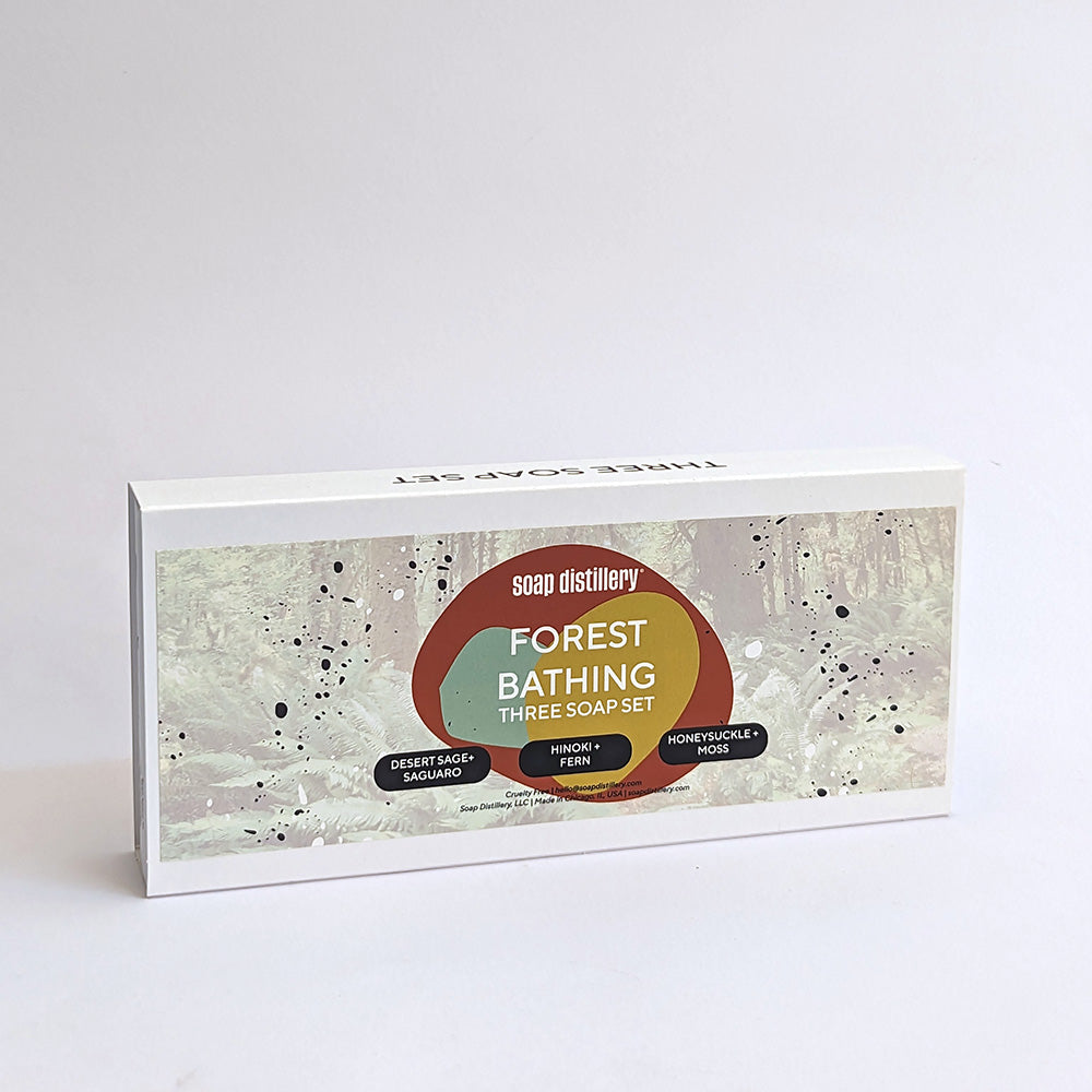 A Forest Bathing three soap gift set in white paperboard packaging with a colorful center against a light grey background